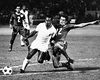 Pelé, left, controls the ball during an exhibition match between Santos and the Oakland Clipper.jpg